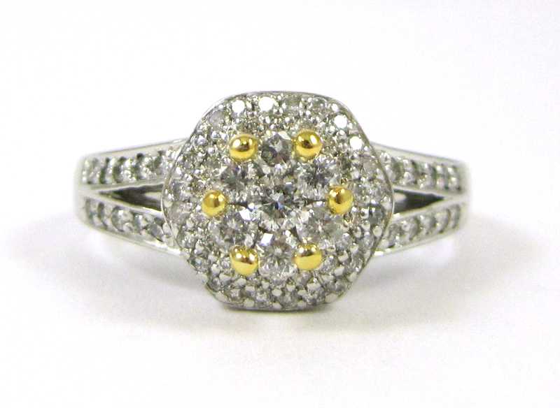 Appraisal: DIAMOND AND FOURTEEN KARAT GOLD RING The white and yellow