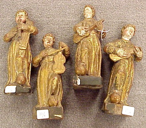 Appraisal: Four carved painted and gilt wooden figures of musicians Continental