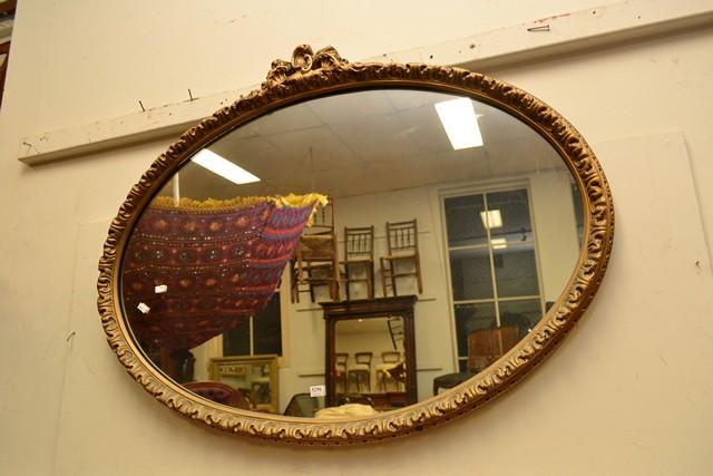 Appraisal: A GILT OVAL MIRROR AND ONE OTHER SMALLER MIRROR A