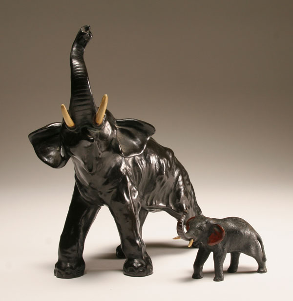 Appraisal: Two vintage Japanese metal trumpeting elephant figures small solid brass