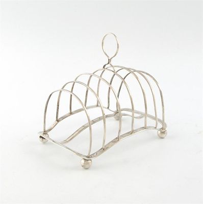 Appraisal: A George III silver seven-bar toast rack by George Ashforth