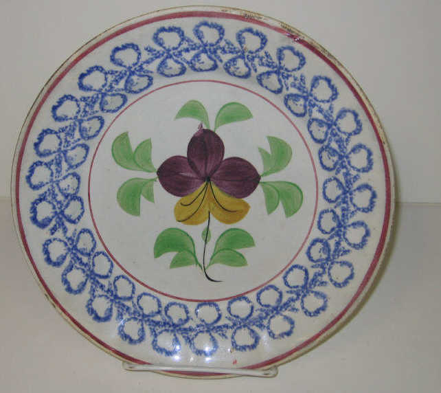 Appraisal: ENGLISH SPATTERWARE Stick spatter plate decorated with blue double loop