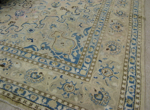 Appraisal: PERSIAN KASHAN CARPET floral and central floral medallion design on