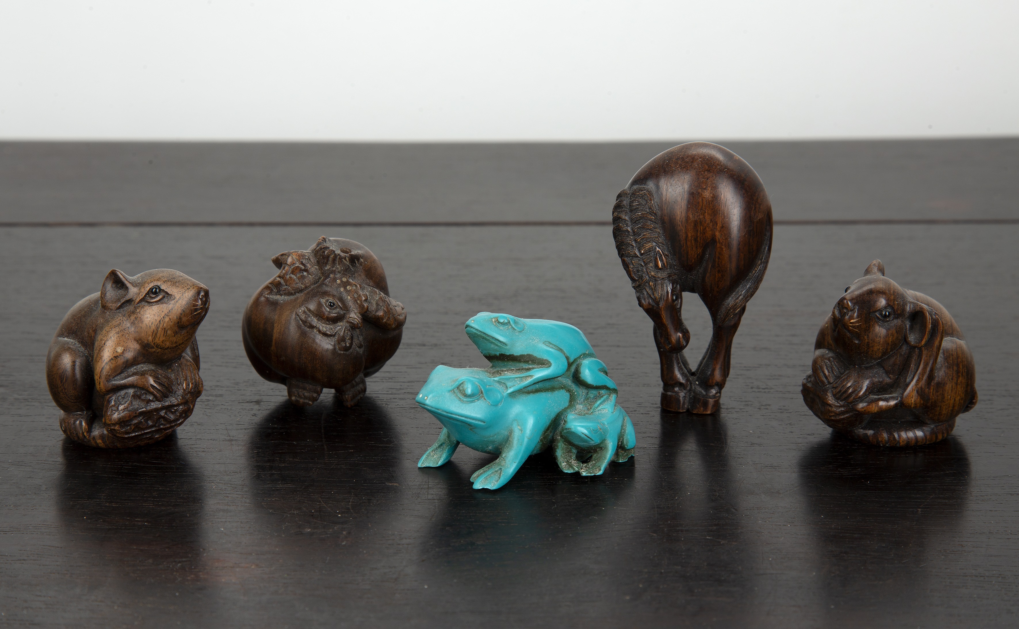 Appraisal: Group of four carved wooden netsukesJapanese to include two mice