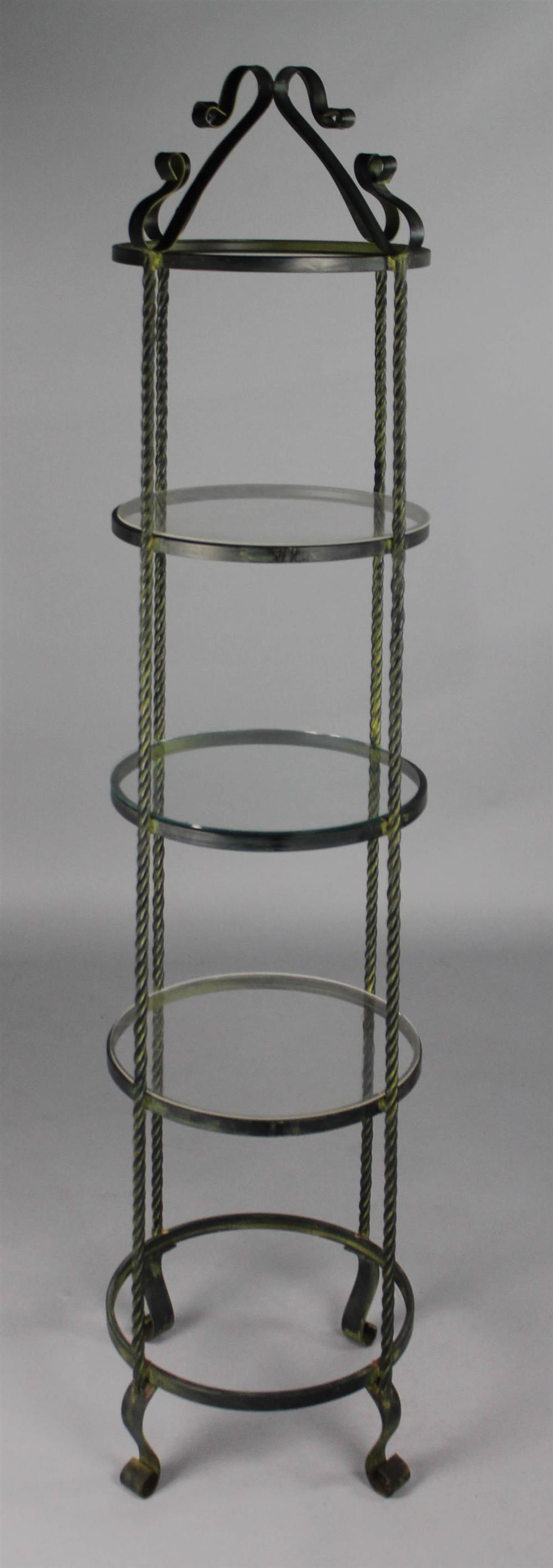 Appraisal: BLACK WROUGHT IRON CIRCULAR TIERED STAND having ribbon style decorated