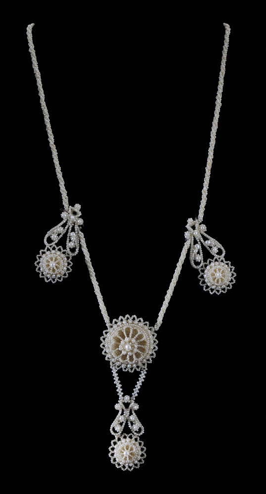 Appraisal: Victorian Seed Pearl Necklace pinwheel and paisley design kt yellow