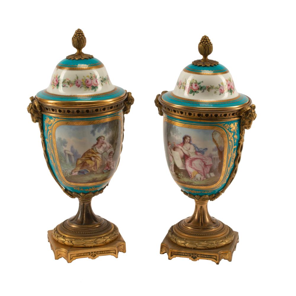 Appraisal: Pair of Sevres Bronze-Mounted Polychrome and Gilt Porcelain Covered Urns