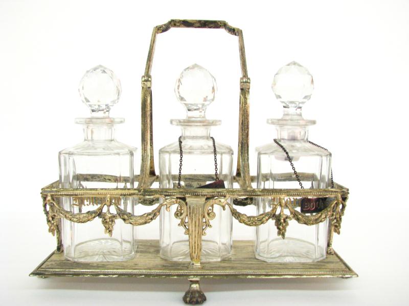 Appraisal: Crystal Decanter Set with cast metal handled frame all with