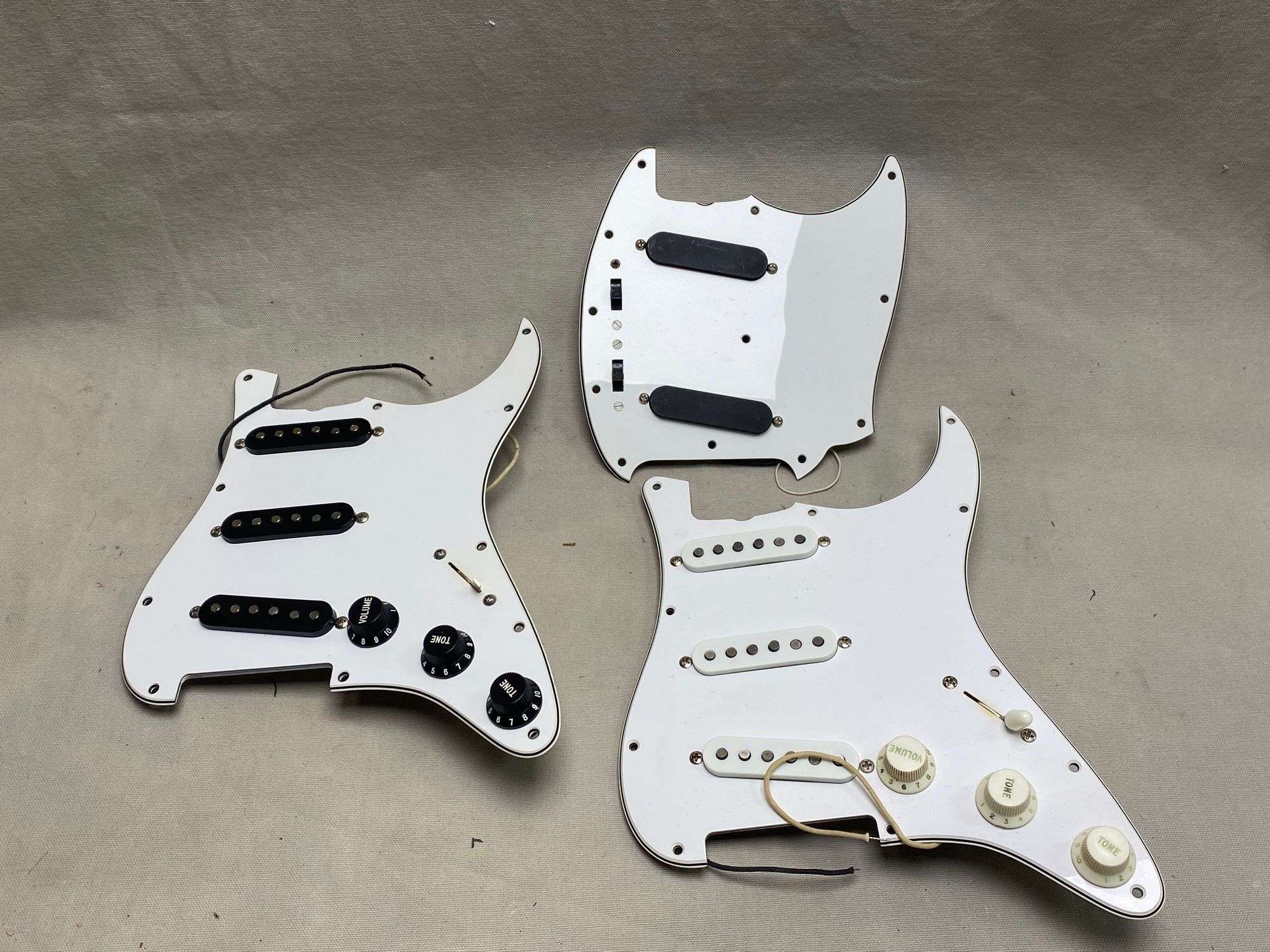 Appraisal: loaded pickguards loaded pickguards All guitars and stringed instruments in