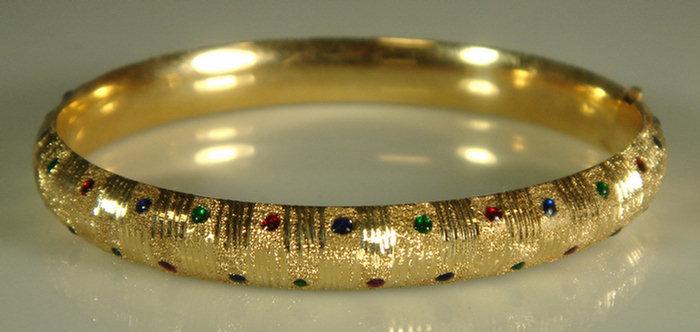 Appraisal: K YG hinged bangle bracelet set with small cabochon rubies