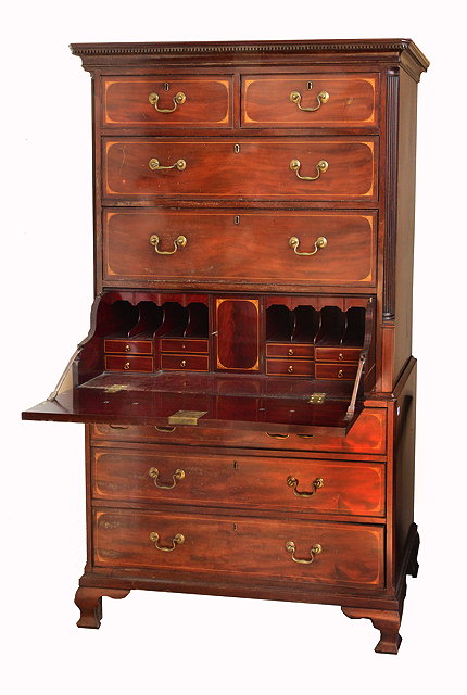 Appraisal: A GEORGE III MAHOGANY SECRETAIRE CHEST ON CHEST with dog