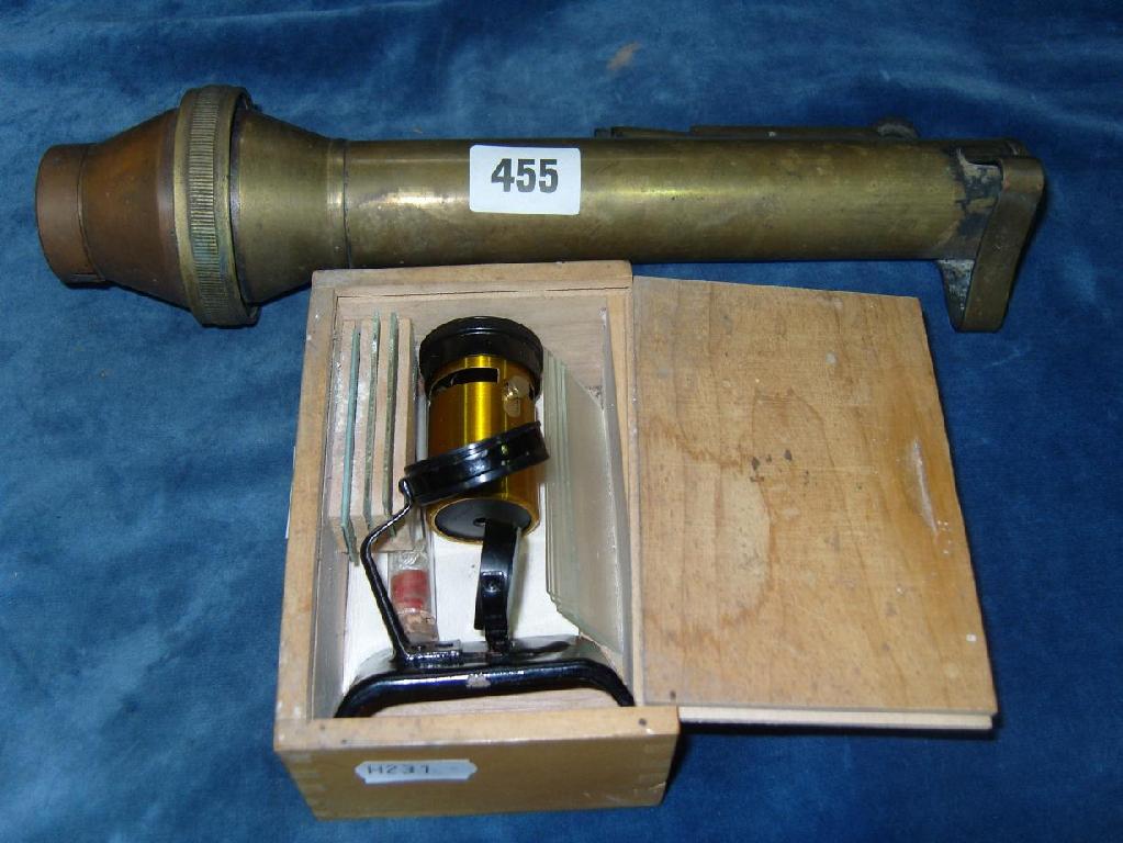 Appraisal: A cased miniature microscope together with a brass cased attachment