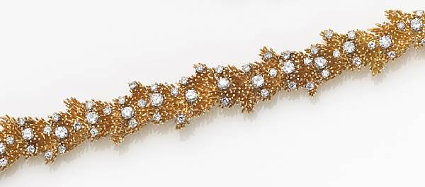 Appraisal: A diamond and eighteen karat gold bracelet of pine needle