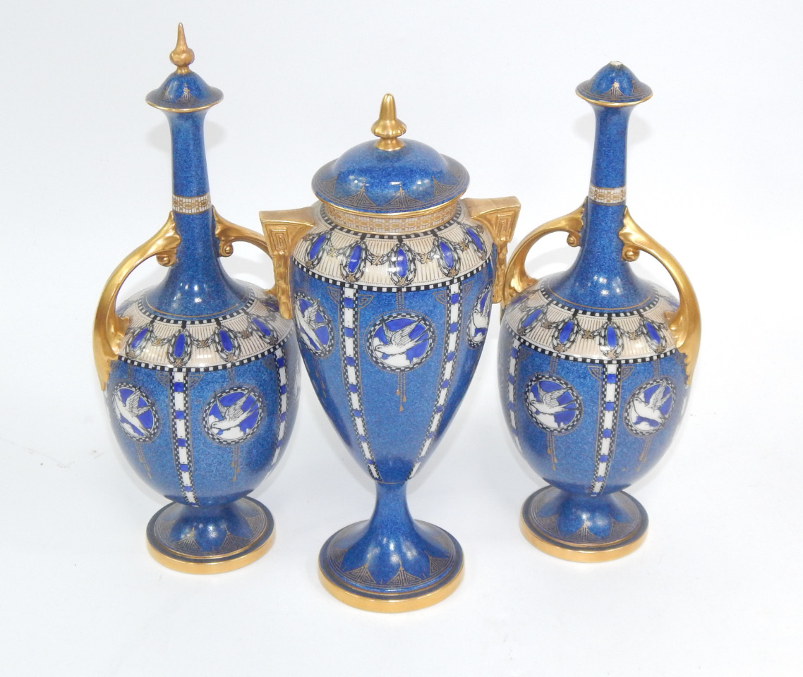 Appraisal: A garniture of Royal Worcester porcelain vases and covers circa