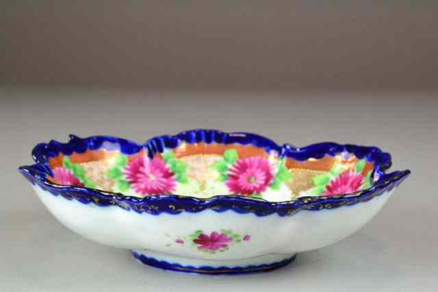 Appraisal: FLORAL NIPPON DISHIncluding polychromed dish having scalloped-shaped rim with cobalt