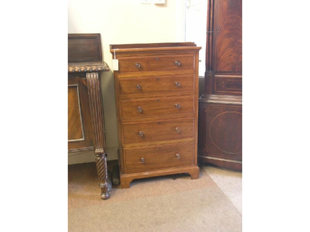 Appraisal: A Victorian mahogany chest five oak-lined drawers each with turned