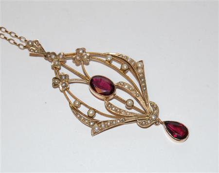 Appraisal: An Edwardian garnet and pearl pendant marked ct the openwork