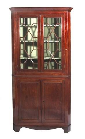 Appraisal: A TH CENTURY MAHOGANY FLOOR STANDING CORNER CABINET in two