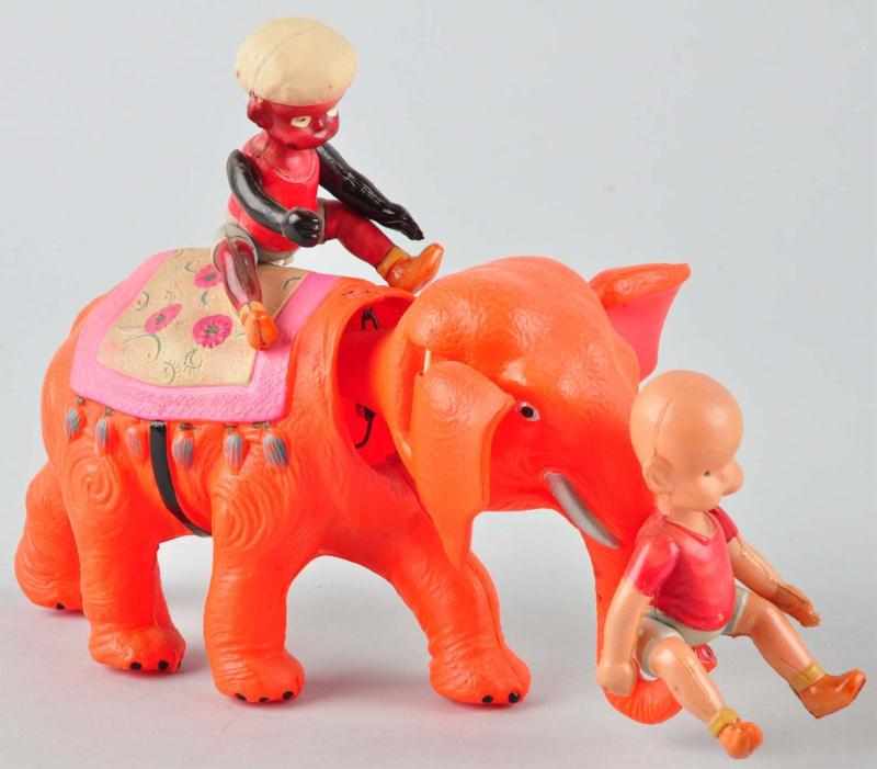 Appraisal: Celluloid Henry on Elephant Wind-Up Toy Description Japanese Pre-war Henry