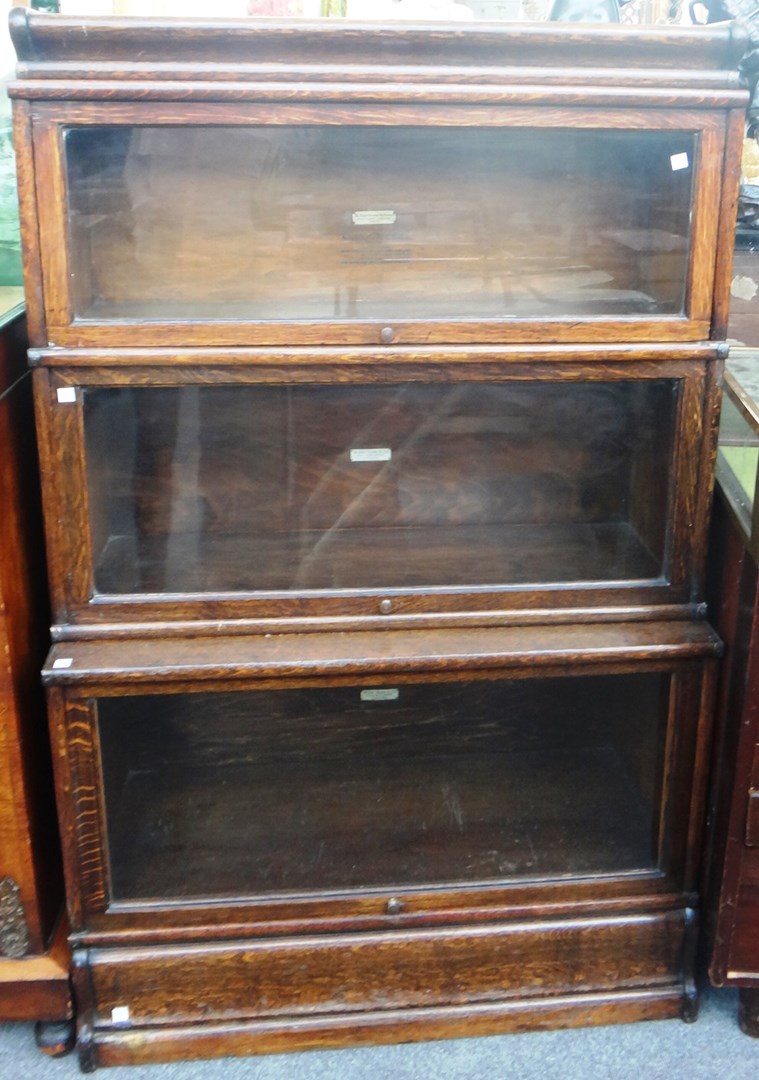 Appraisal: An oak Globe Wernicke three tier bookcase cm wide