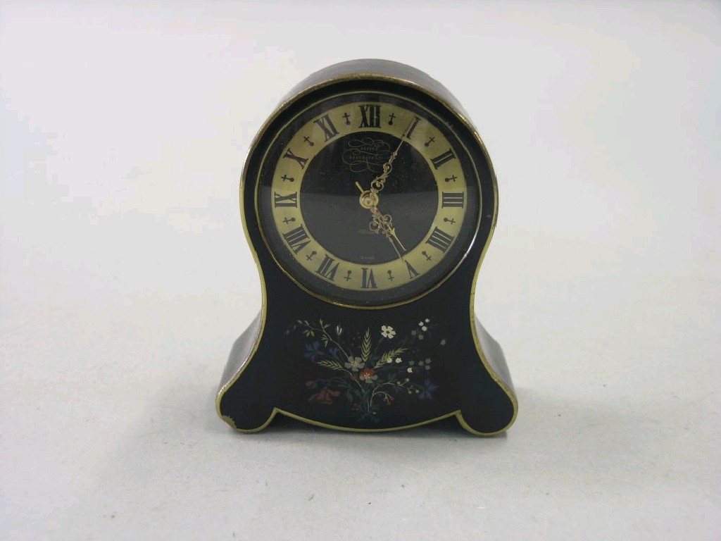 Appraisal: A Jaeger musical mantel clock contained within black metal frame