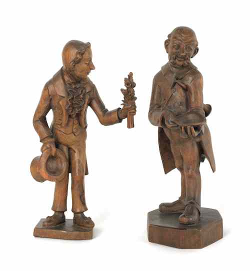 Appraisal: Two carved figures of gentlemen th c h and h