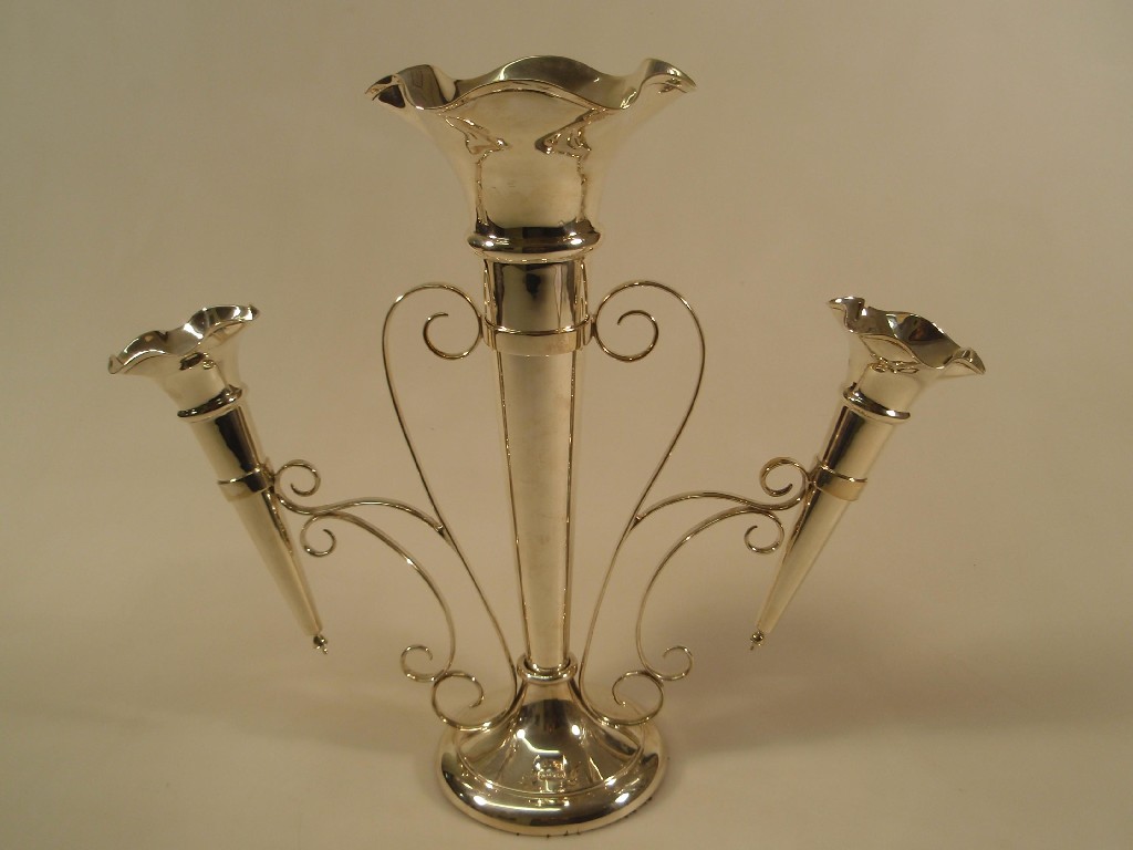 Appraisal: A George V silver three flute table epergne the principal