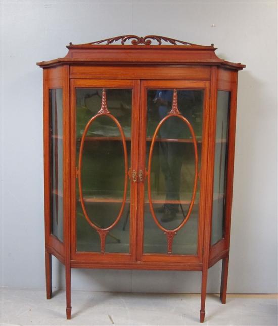 Appraisal: Early th century satinwood serpentine sided display cabinet by H