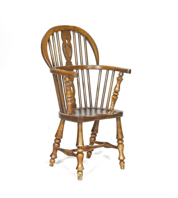 Appraisal: A CHILD'S WINDSOR CHAIR England th c Dark stained ash