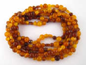 Appraisal: A two row amber bead necklace longer row approx cm