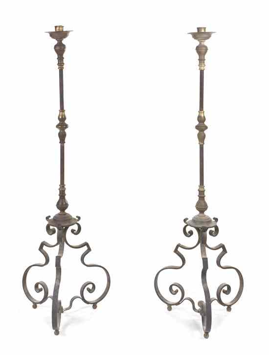 Appraisal: A Pair of Continental Iron and Brass Torchieres each having