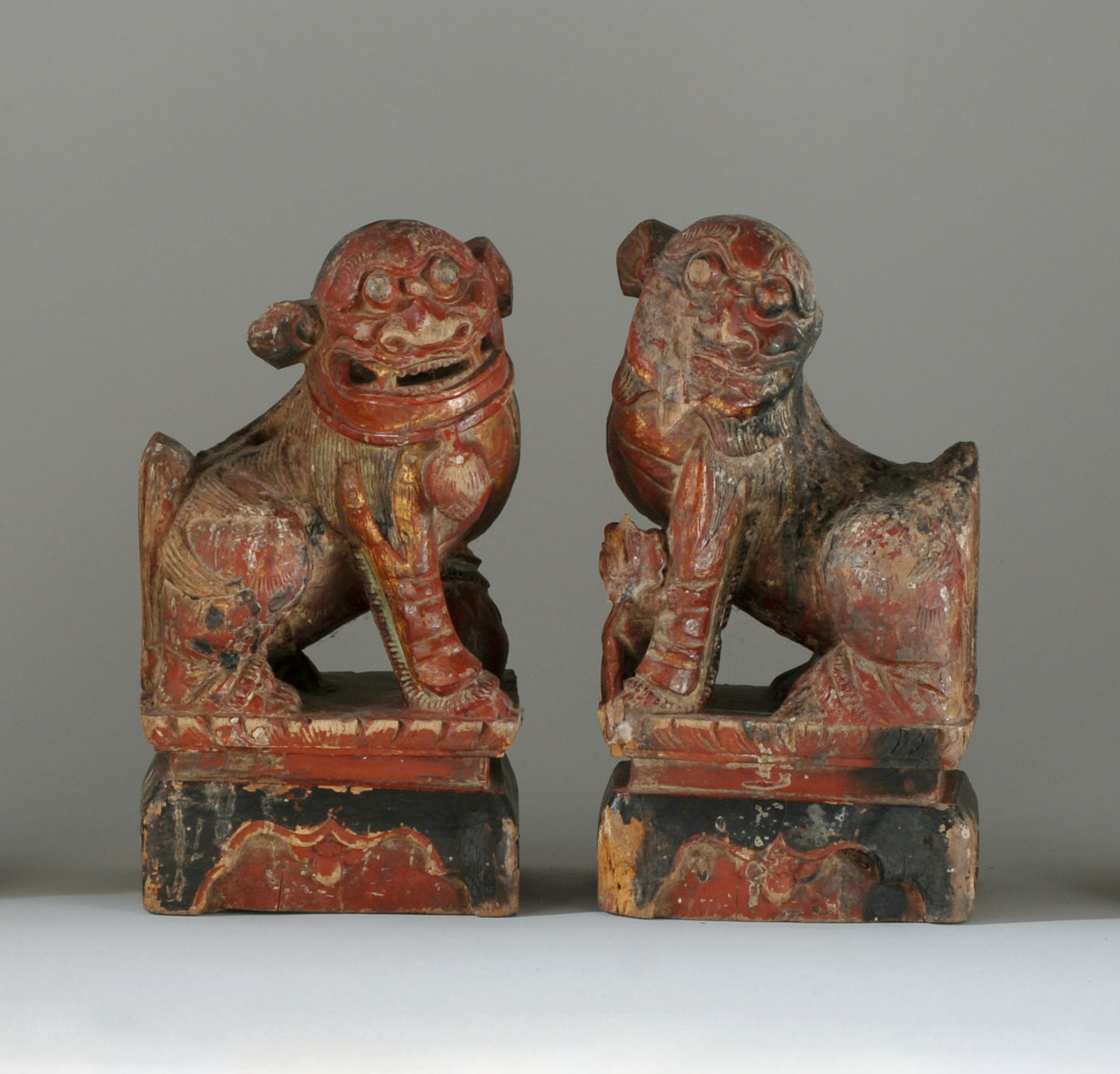 Appraisal: PAIR OF PAINTED AND CARVED WOOD GUARDIAN LIONS th CenturyEach