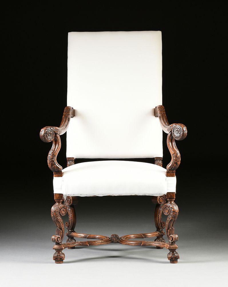 Appraisal: AN ITALIAN BAROQUE STYLE CARVED WALNUT THRONE ARMCHAIR CIRCA AN