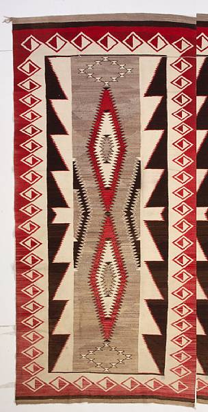 Appraisal: A large Navajo rug Centering a pair of narrow sawtooth