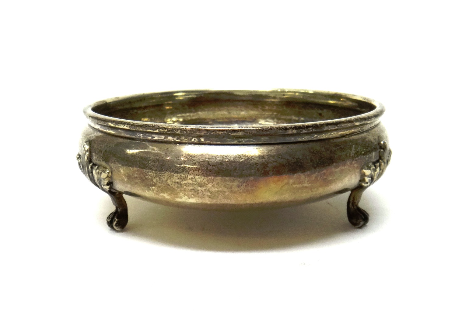 Appraisal: A silver bowl of shallow circular form raised on three