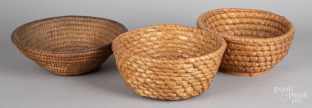 Appraisal: Three rye straw baskets Three rye straw baskets largest -