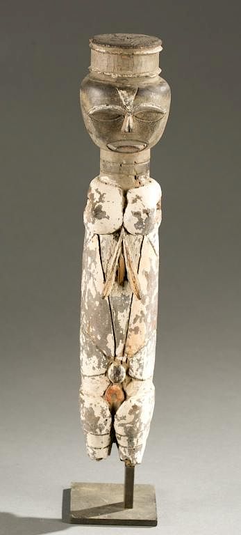 Appraisal: Ibibio style figure with hat th cen A cylindrical white