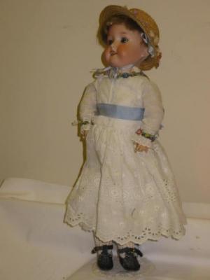 Appraisal: An Armand Marseille bisque head girl doll with blue glass