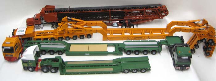 Appraisal: EIGHT DIECAST SCALE MODELS OF HEAVY HAUL TRUCKS Superior Peterbilt