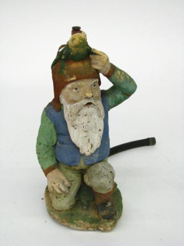 Appraisal: Vintage painted concrete yard sprinkler depicting a gnome concrete around