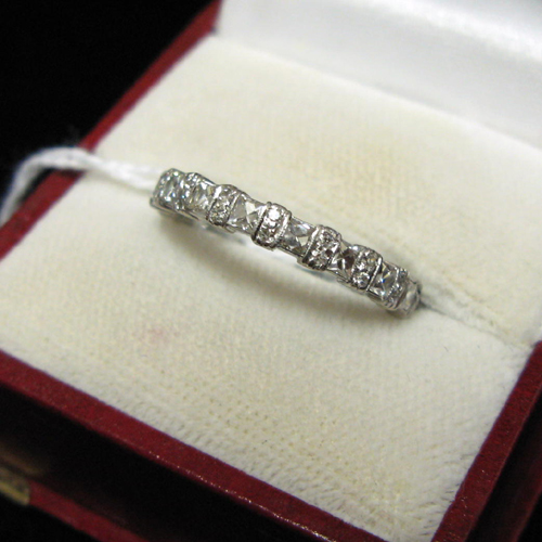 Appraisal: DIAMOND AND PLATINUM ETERNITY RING WITH APPRAISAL The band's exterior