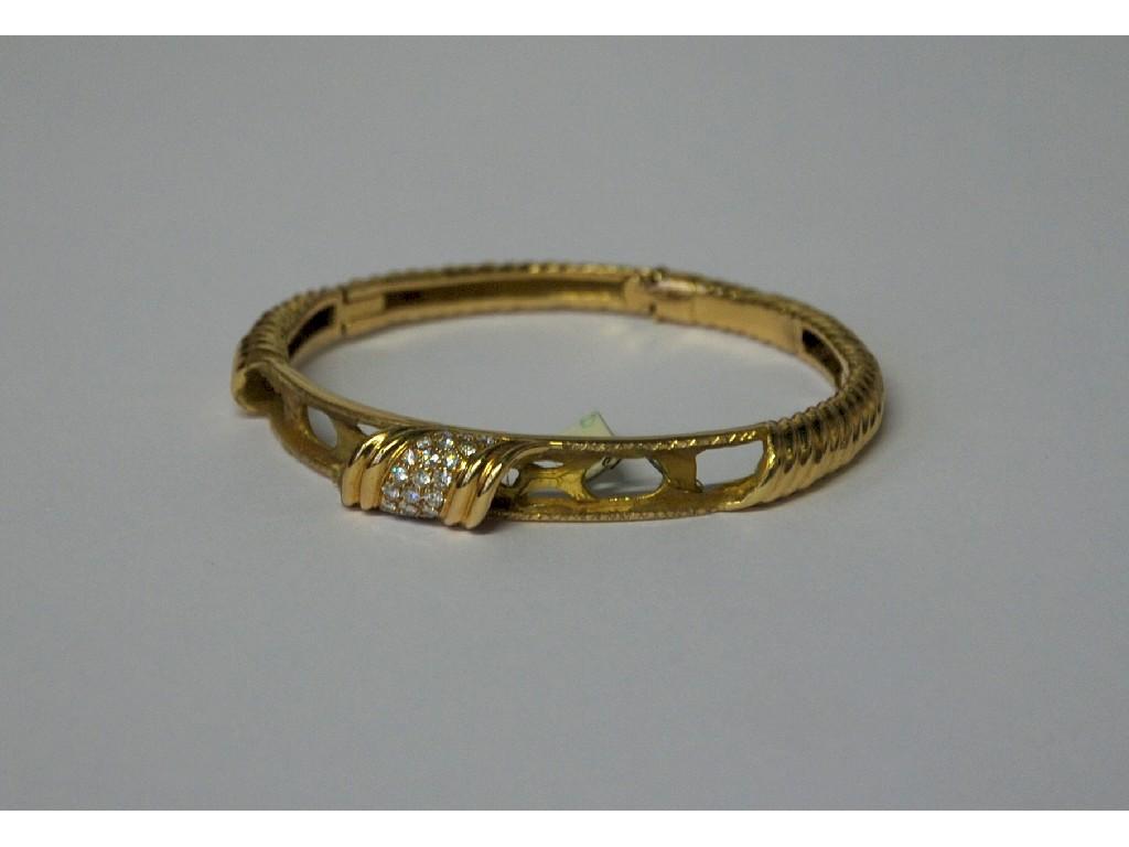 Appraisal: ct GOLD IVORY AND DIAMOND HINGE OPENING BANGLE graduating in