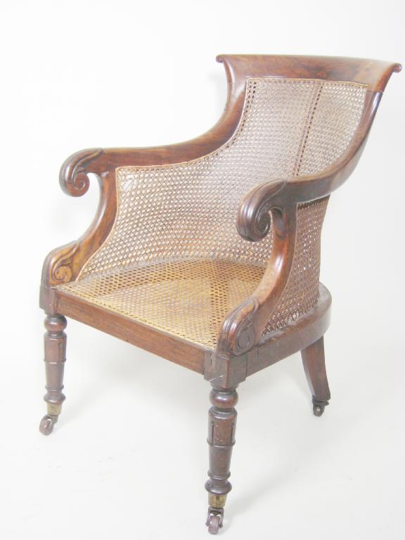 Appraisal: A Regency rosewood Bergere Library Chair with cane panelled back