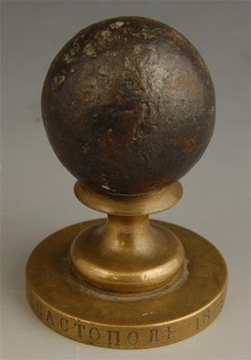 Appraisal: A Russian paperweight with a in cm diameter cannon ball