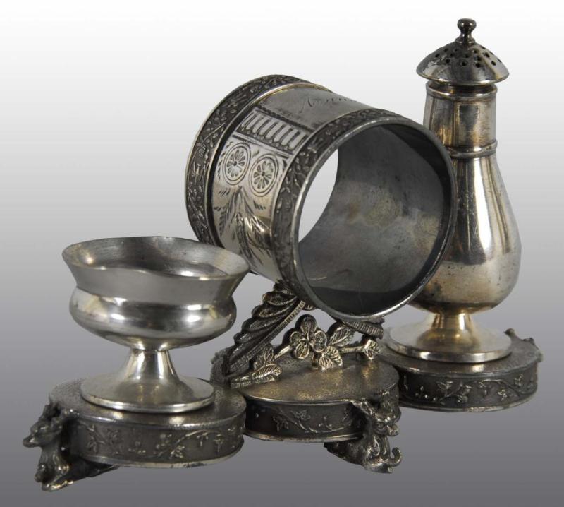 Appraisal: Figural Napkin Ring Salt Pepper Combination Set Description Webster With