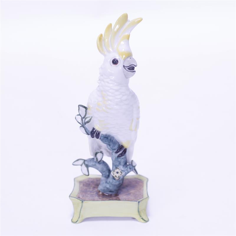 Appraisal: Nymphenburg Porcelain Cockatoo with Yellow Accent Feathers on a Green