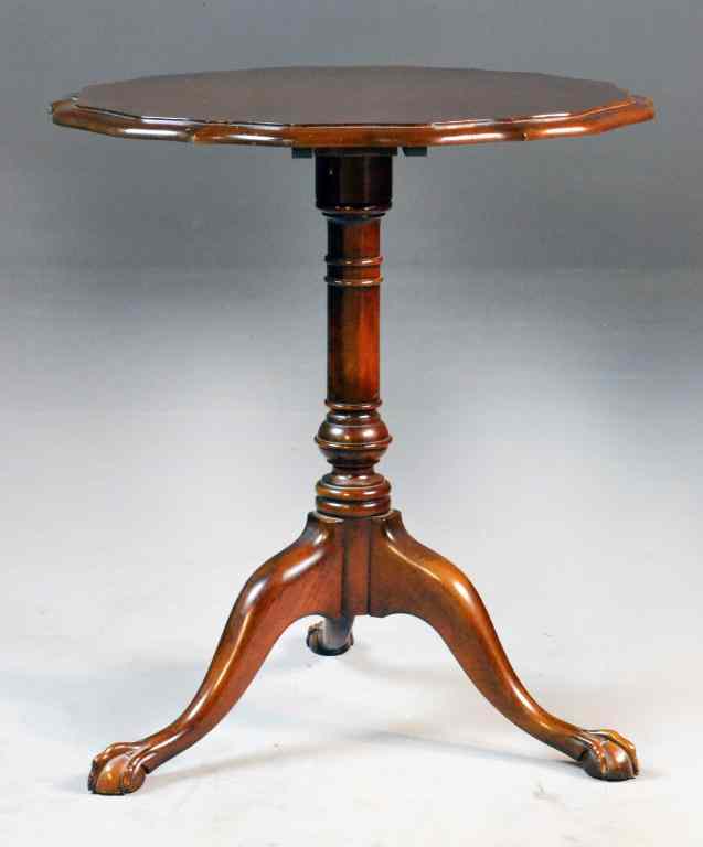 Appraisal: Mahogany Piecrust TableScalloped top tilts turned pedestal raised on three