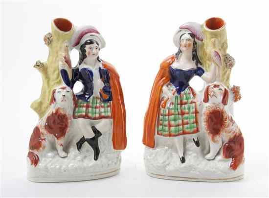 Appraisal: Two Staffordshire Figural Spill Vases one depicting a boy with