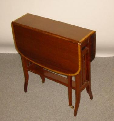 Appraisal: AN EDWARDIAN MAHOGANY SUTHERLAND TABLE of rounded oblong form with