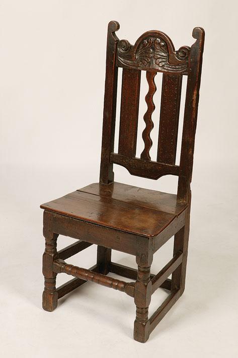 Appraisal: A CHARLES II OAK SIDE CHAIR the arched top rail